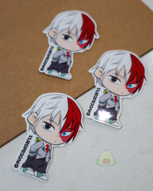 Handmade vinyl sticker of Todoroki from My Hero Academia by Avocado Artt, showing his half-hot, half-cold quirk with flames and ice effects.