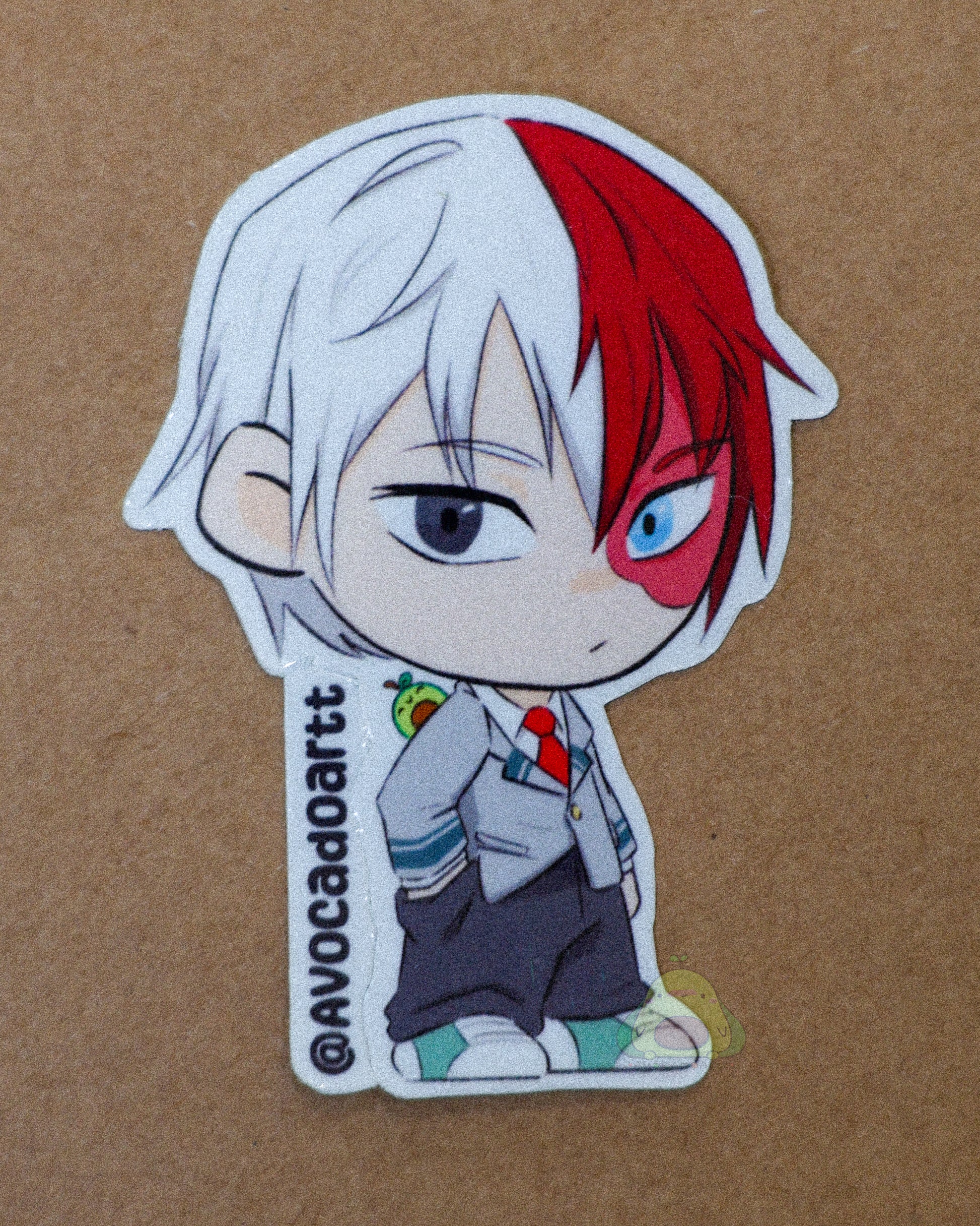 Handmade vinyl sticker of Todoroki from My Hero Academia by Avocado Artt, showing his half-hot, half-cold quirk with flames and ice effects.