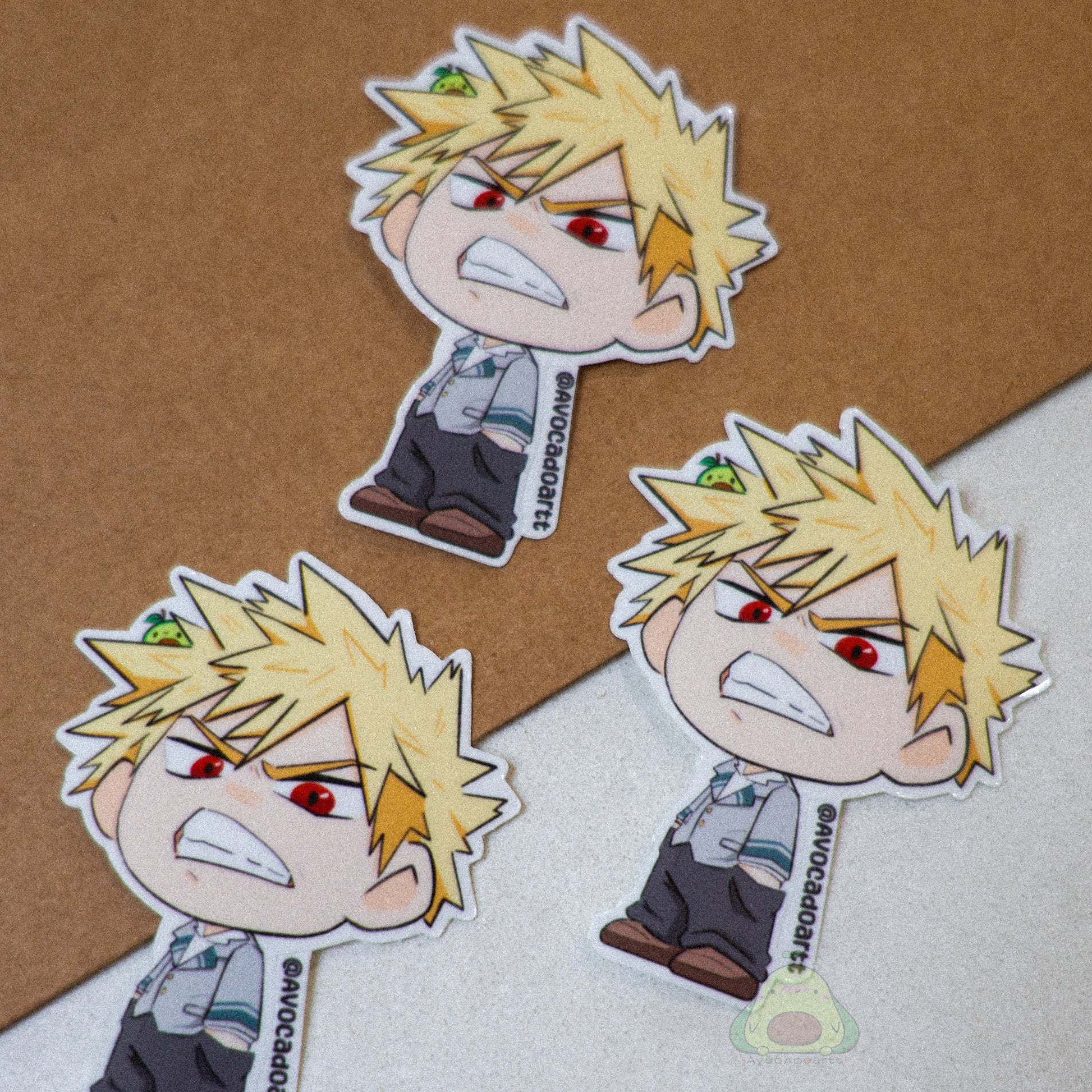 Handmade vinyl sticker of Bakugo from My Hero Academia, illustrated by Avocado Artt in an explosive pose with dynamic expression.