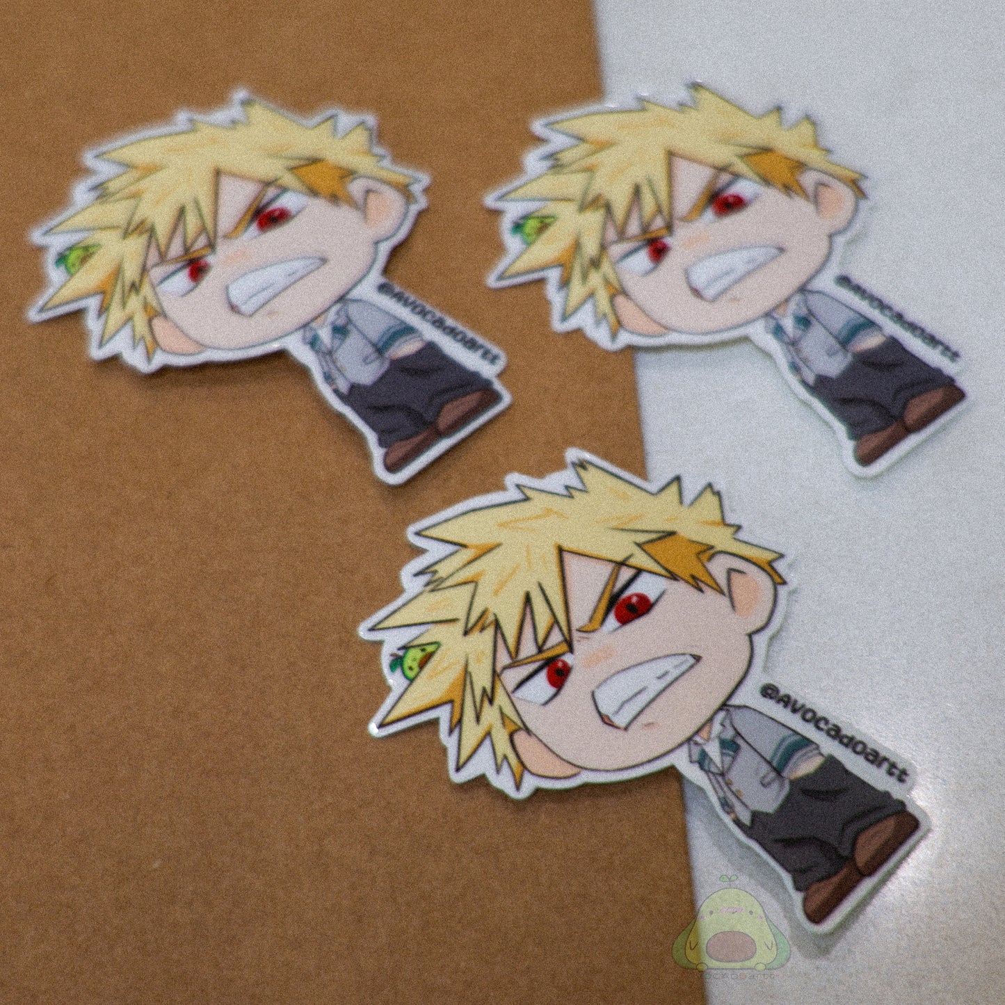 Handmade vinyl sticker of Bakugo from My Hero Academia, illustrated by Avocado Artt in an explosive pose with dynamic expression.
