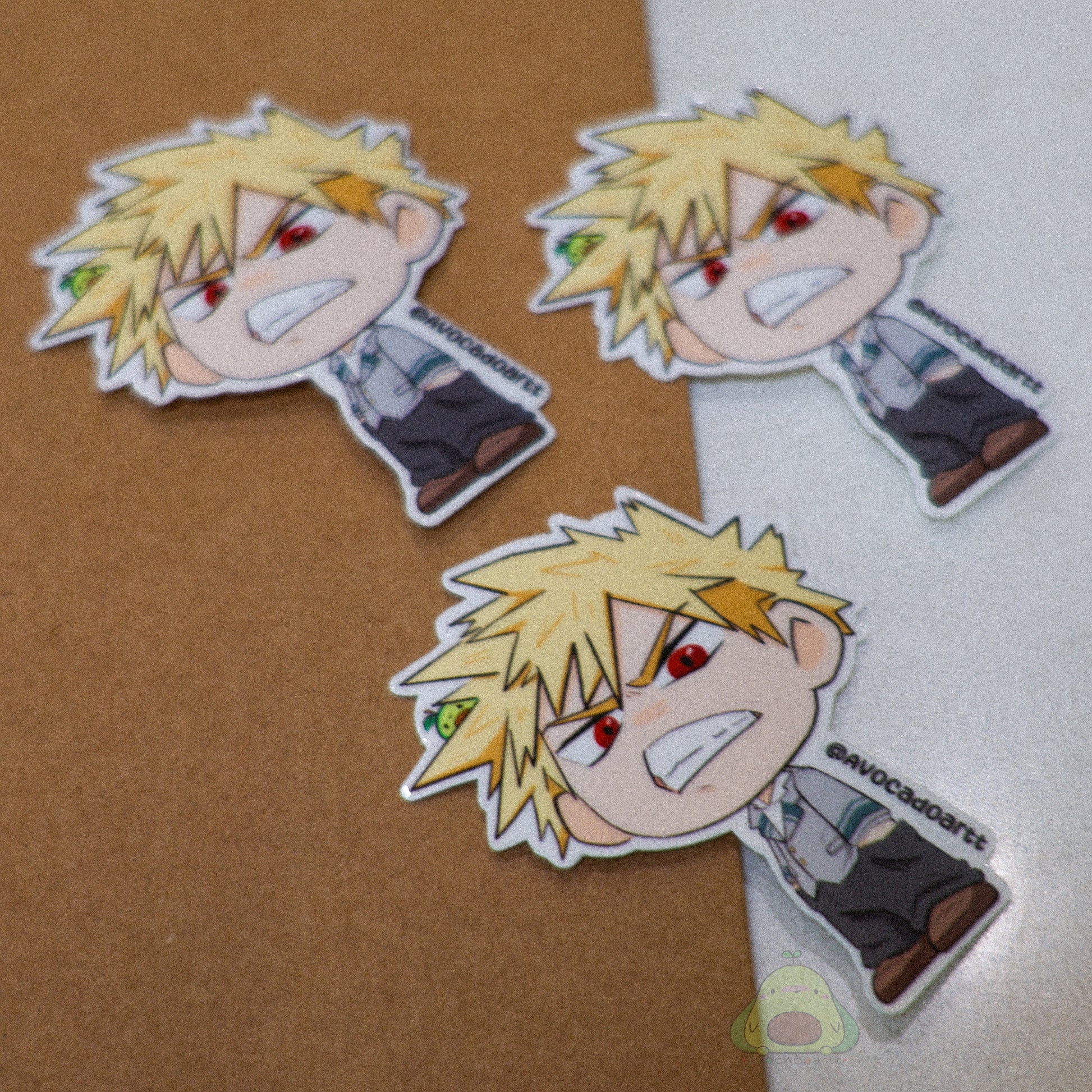 Handmade vinyl sticker of Bakugo from My Hero Academia, illustrated by Avocado Artt in an explosive pose with dynamic expression.