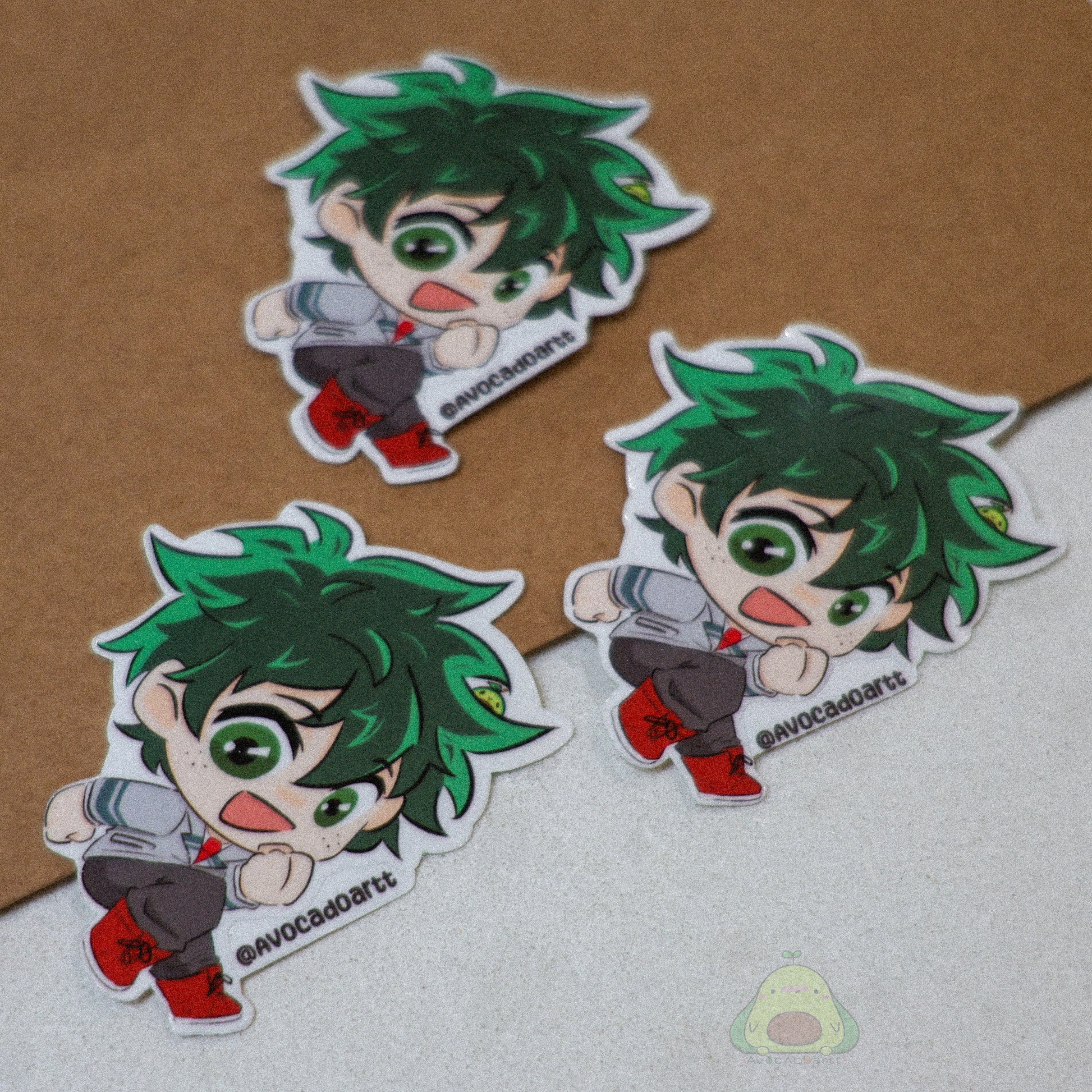 Handmade vinyl sticker of Midoriya (Deku) from My Hero Academia, designed by Avocado Artt, featuring his classic green hair and hero outfit.