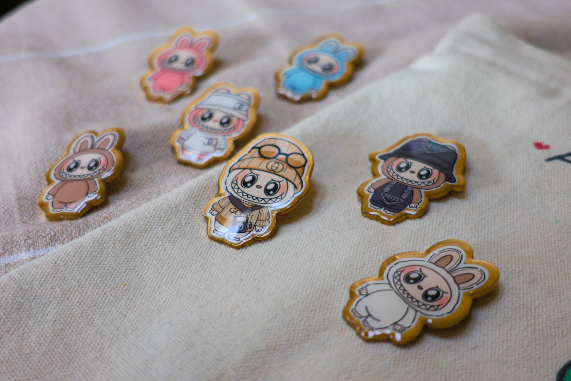 Handmade Labubu pin with gold butterfly clasp, featuring a cute character design, perfect for accessorizing bags, jackets, or ita bags. Created by Avocado Artt.