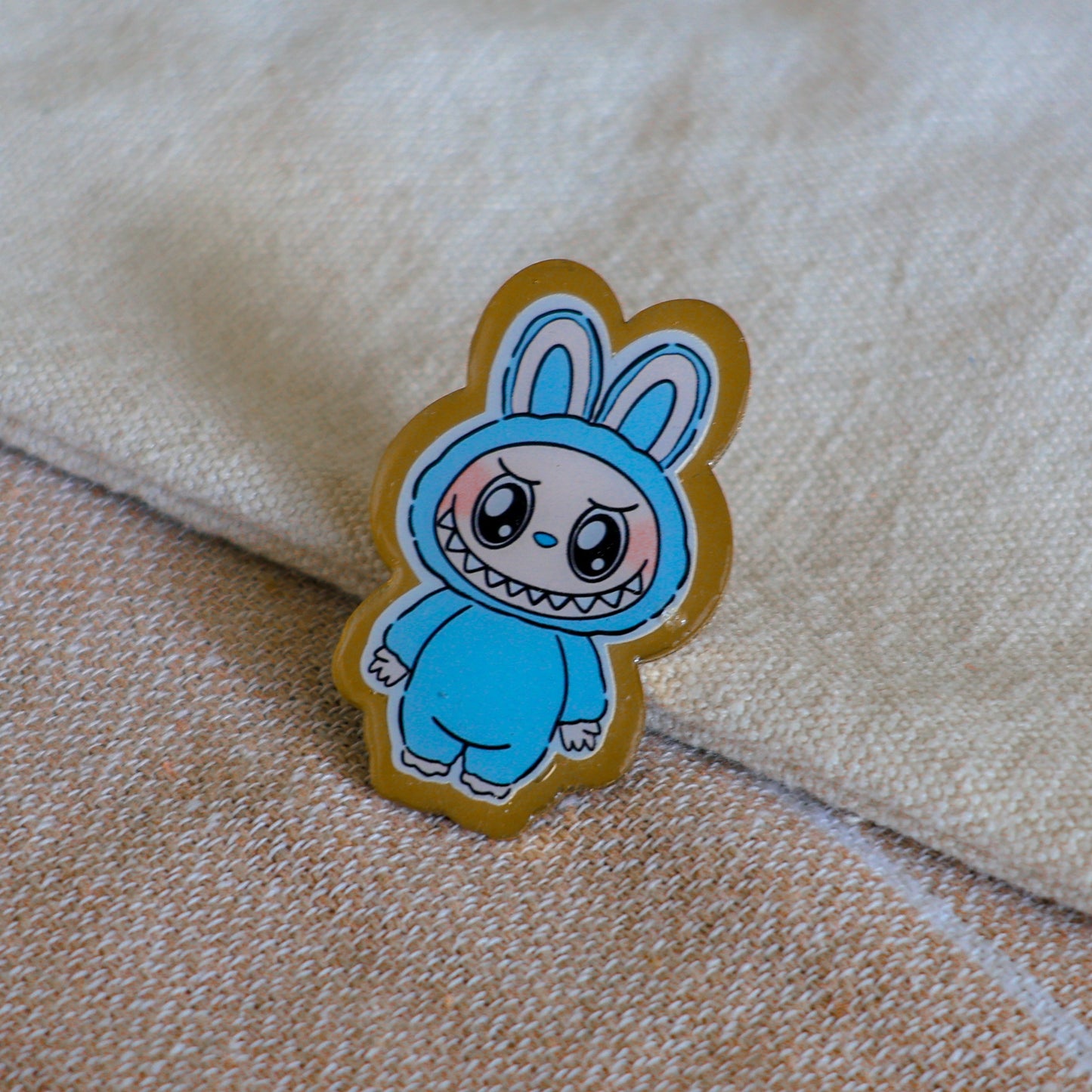 Handmade Labubu pin with gold butterfly clasp, featuring a cute character design, perfect for accessorizing bags, jackets, or ita bags. Created by Avocado Artt.