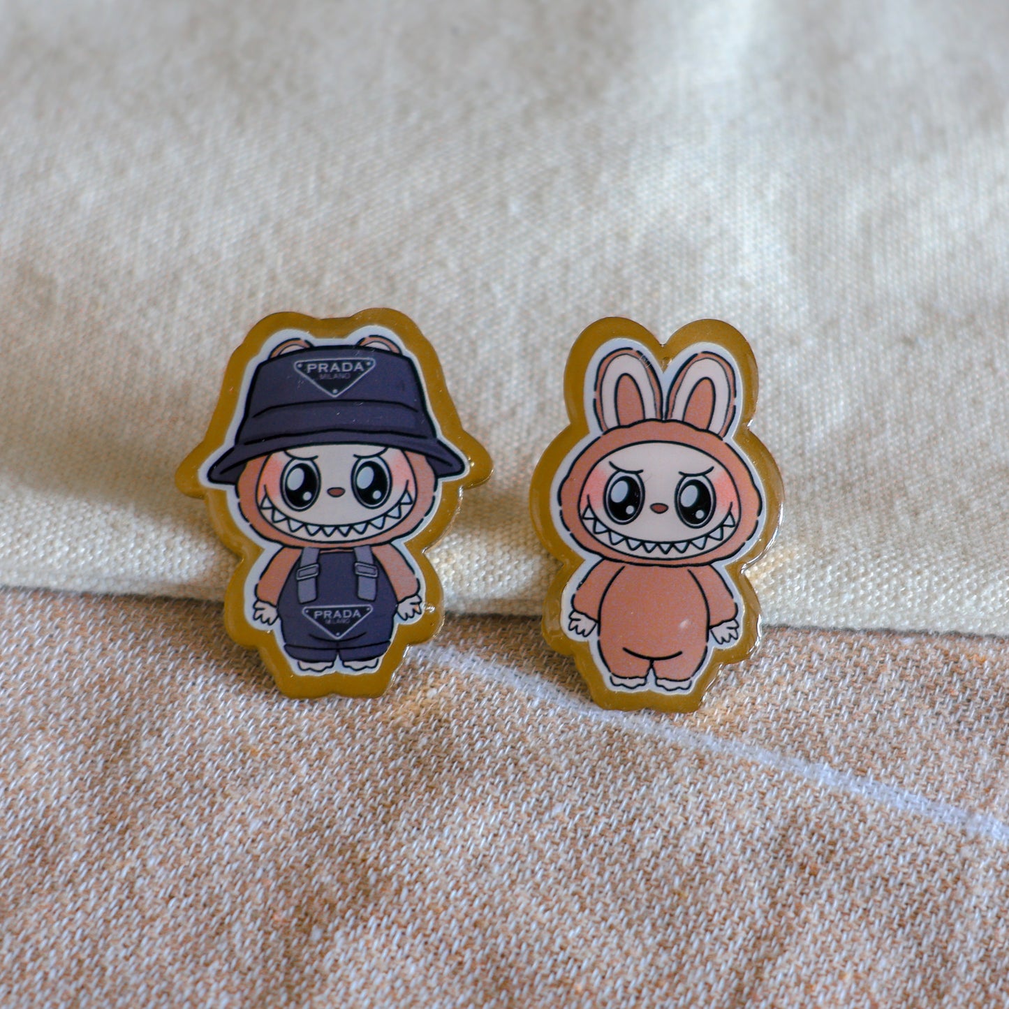Handmade Labubu pin with gold butterfly clasp, featuring a cute character design, perfect for accessorizing bags, jackets, or ita bags. Created by Avocado Artt.