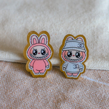 Handmade Labubu pin with gold butterfly clasp, featuring a cute character design, perfect for accessorizing bags, jackets, or ita bags. Created by Avocado Artt.