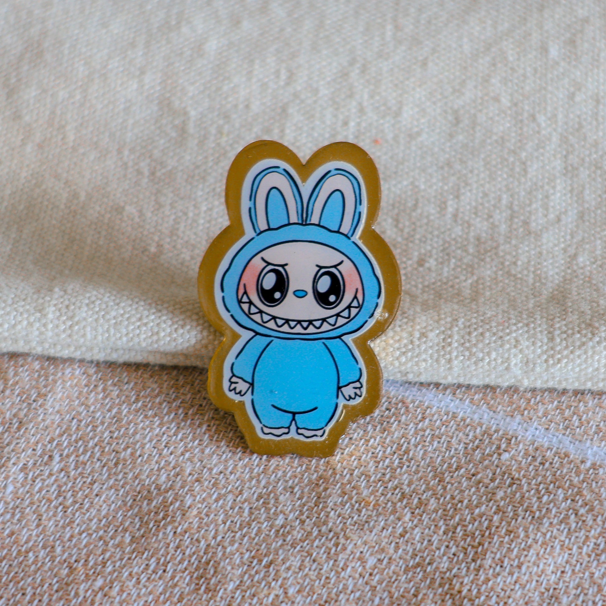 Handmade Labubu pin with gold butterfly clasp, featuring a cute character design, perfect for accessorizing bags, jackets, or ita bags. Created by Avocado Artt.