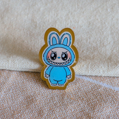 Handmade Labubu pin with gold butterfly clasp, featuring a cute character design, perfect for accessorizing bags, jackets, or ita bags. Created by Avocado Artt.
