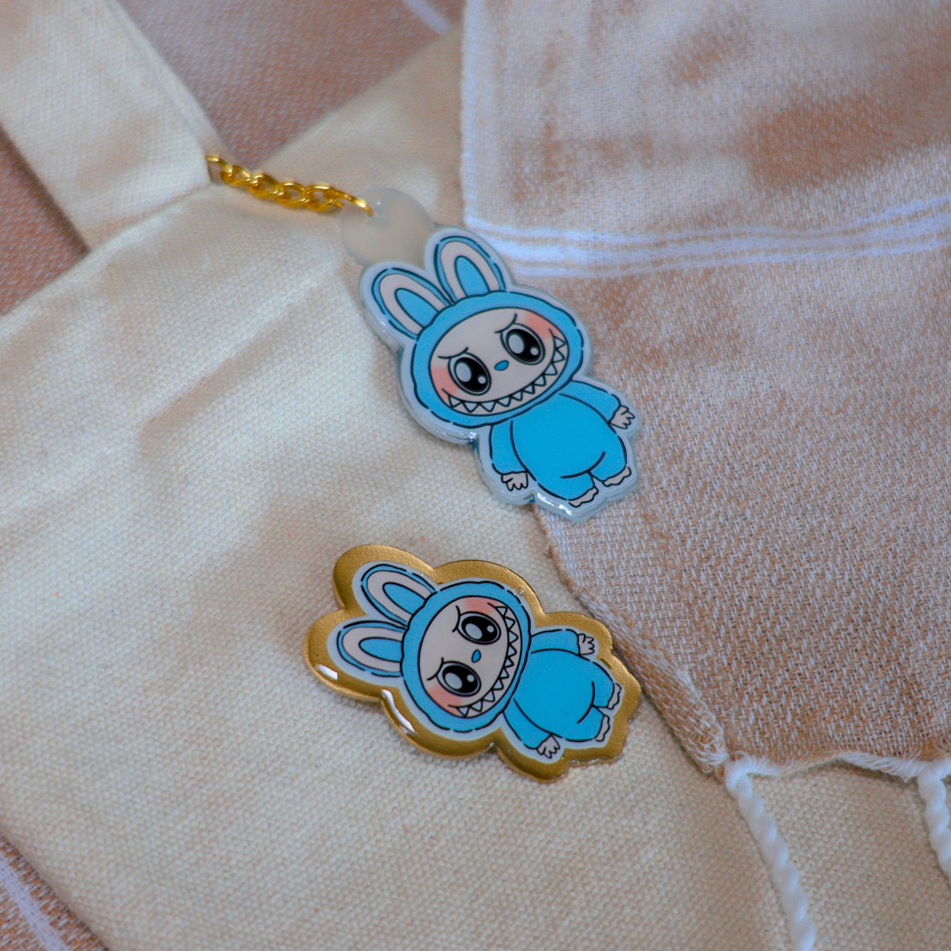 Handmade Labubu pin with gold butterfly clasp, featuring a cute character design, perfect for accessorizing bags, jackets, or ita bags. Created by Avocado Artt.