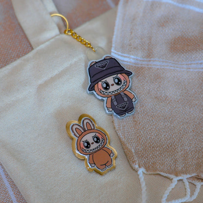 Handmade Labubu pin with gold butterfly clasp, featuring a cute character design, perfect for accessorizing bags, jackets, or ita bags. Created by Avocado Artt.