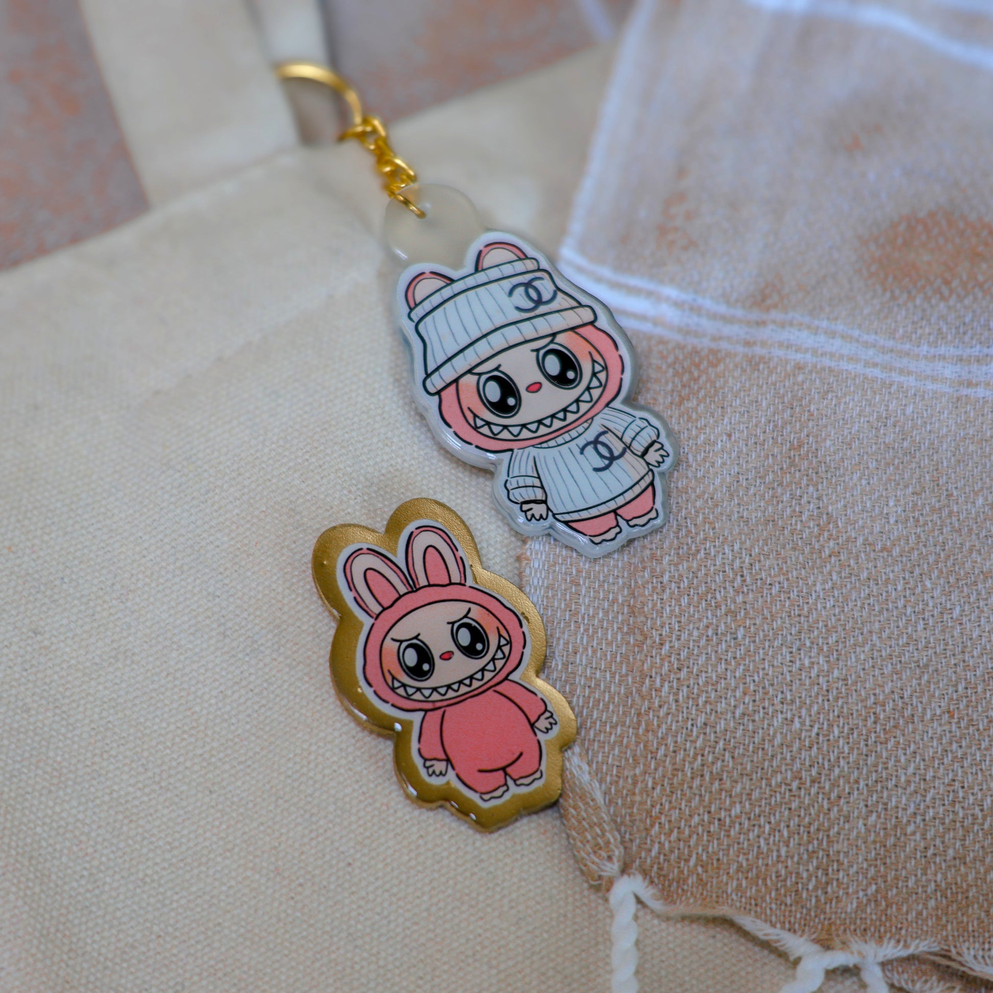 Handmade Labubu pin with gold butterfly clasp, featuring a cute character design, perfect for accessorizing bags, jackets, or ita bags. Created by Avocado Artt.