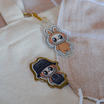 Handmade Labubu pin with gold butterfly clasp, featuring a cute character design, perfect for accessorizing bags, jackets, or ita bags. Created by Avocado Artt.