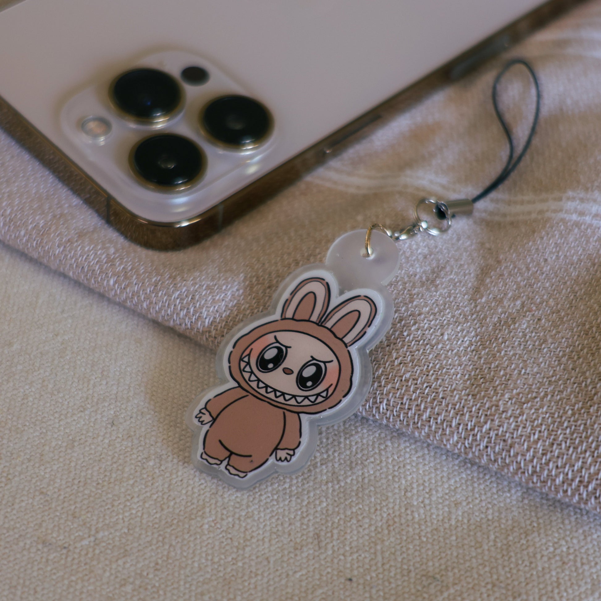 Handmade Labubu phone charm with Silver hardware, featuring a cute character design, perfect for accessorizing phones, bags, or keyrings. Designed by Avocado Artt