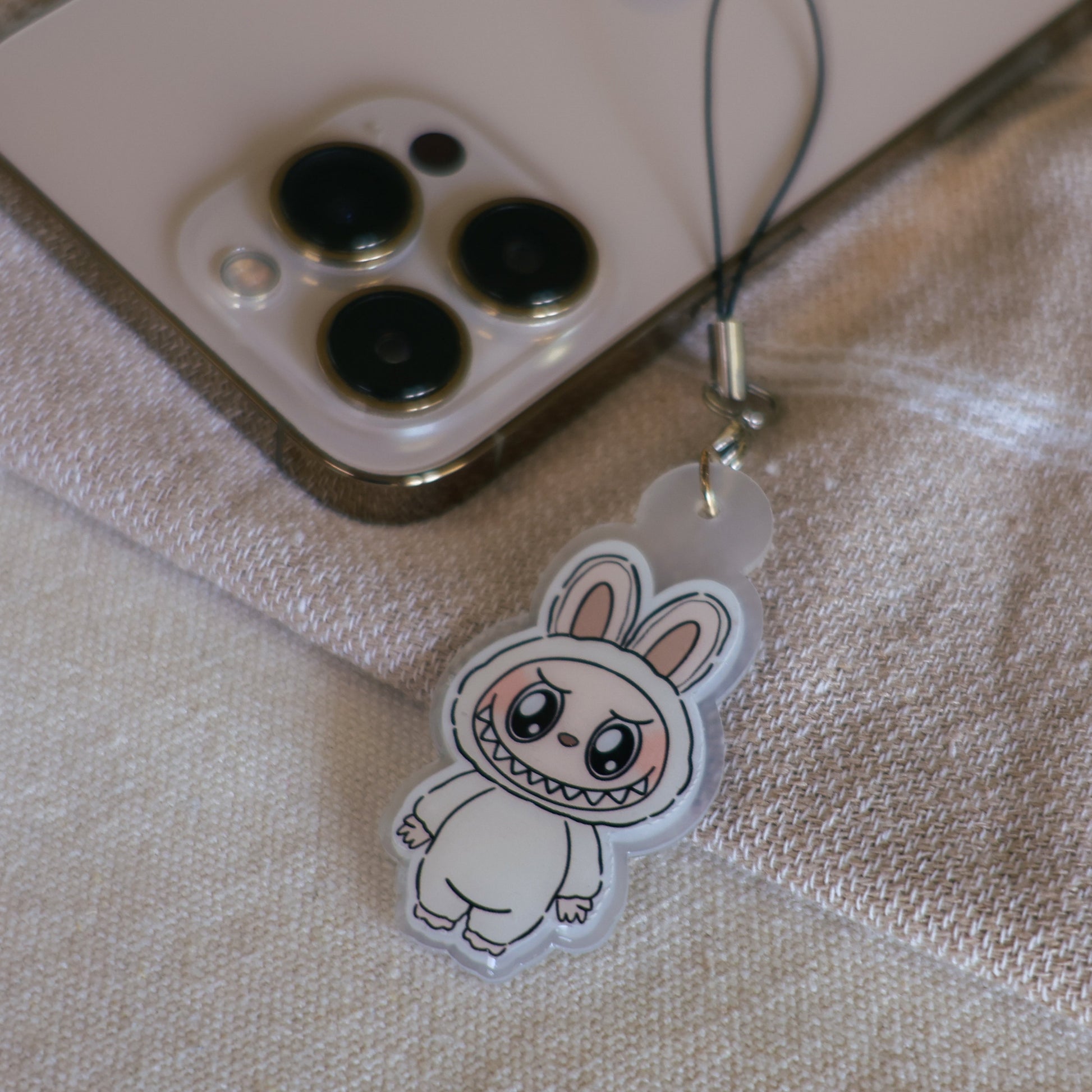 Handmade Labubu phone charm with Silver hardware, featuring a cute character design, perfect for accessorizing phones, bags, or keyrings. Designed by Avocado Artt