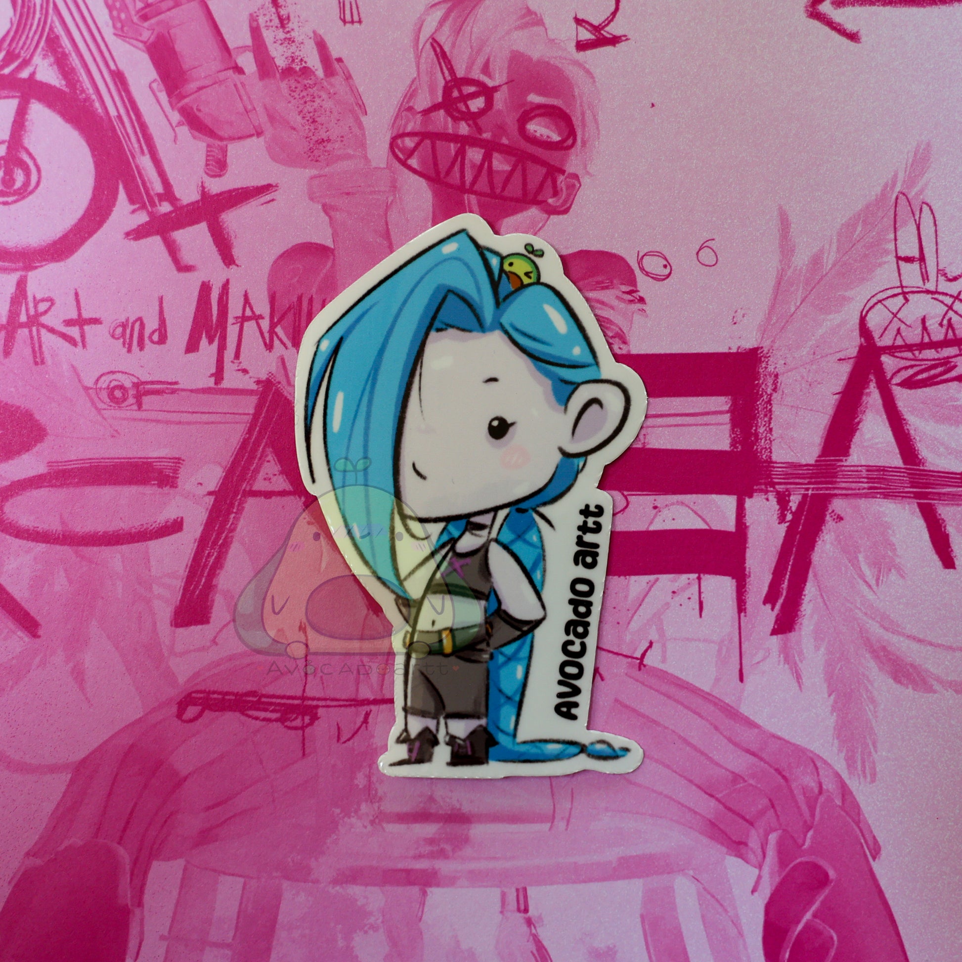 Handmade waterproof vinyl sticker of Jinx from Arcane, illustrated by Avocado Artt, featuring her signature pigtails, mischievous expression, and chaotic vibe
