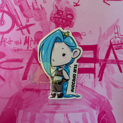 Handmade waterproof vinyl sticker of Jinx from Arcane, illustrated by Avocado Artt, featuring her signature pigtails, mischievous expression, and chaotic vibe