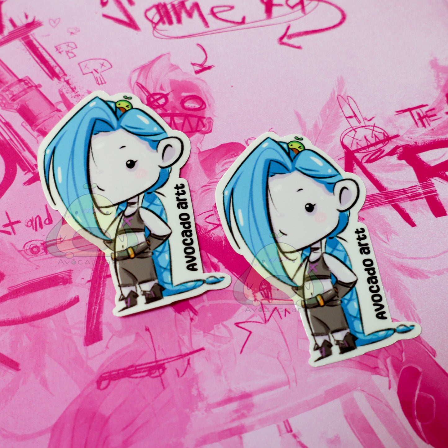 Handmade waterproof vinyl sticker of Jinx from Arcane, illustrated by Avocado Artt, featuring her signature pigtails, mischievous expression, and chaotic vibe