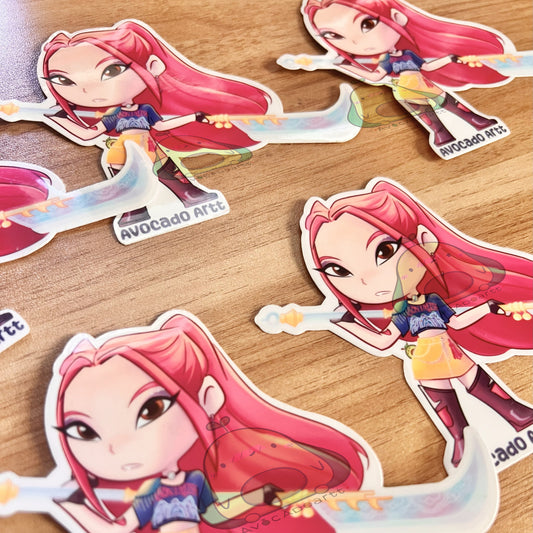 Handmade vinyl sticker of Mira from K-Pop Demon Hunters, illustrated by Avocado Artt, featuring Mira in a bold, idol-inspired outfit with dynamic pose and aesthetic detail.