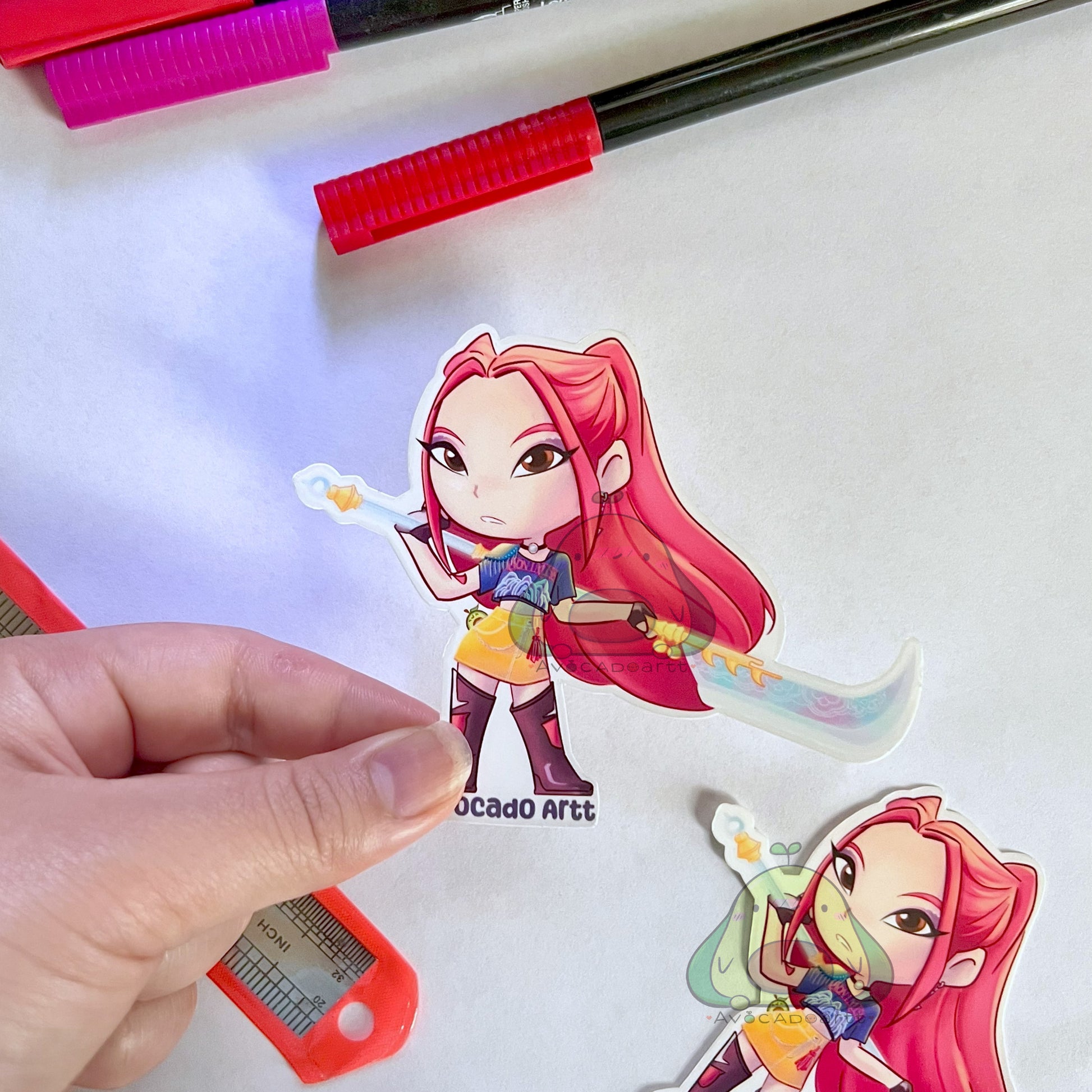 Handmade vinyl sticker of Mira from K-Pop Demon Hunters, illustrated by Avocado Artt, featuring Mira in a bold, idol-inspired outfit with dynamic pose and aesthetic detail.