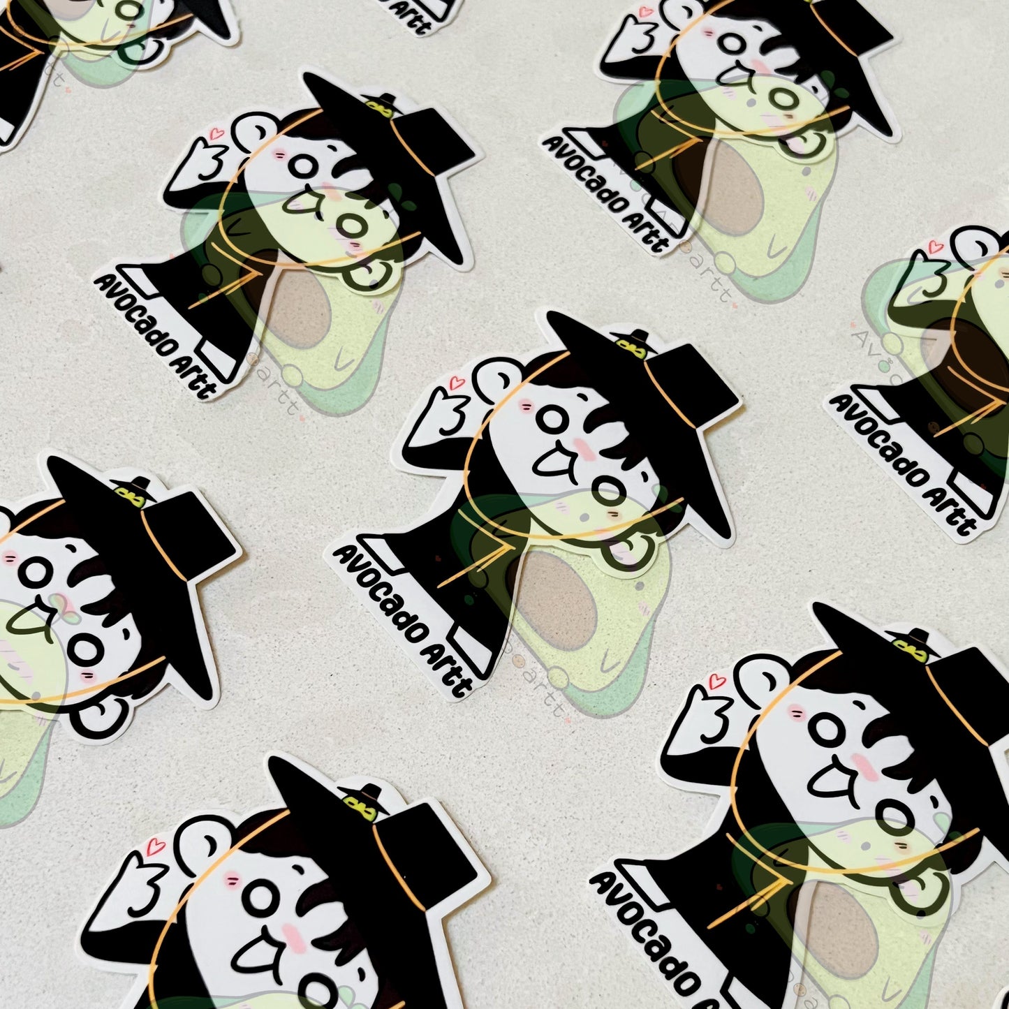 Repeating pattern of cartoon avocado characters with hats on a light background