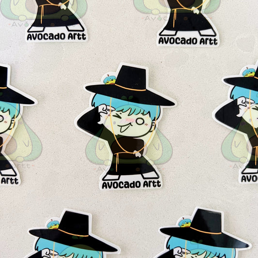 Stickers of a character with blue hair and a black hat on a white background, branded 'Avocado Artt'.