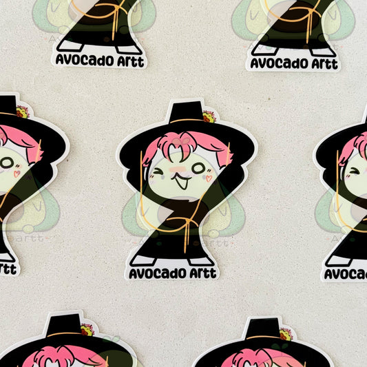 Sticker design of a character with pink hair and black hat on a light gray background, labeled 'Avocado Artt'.