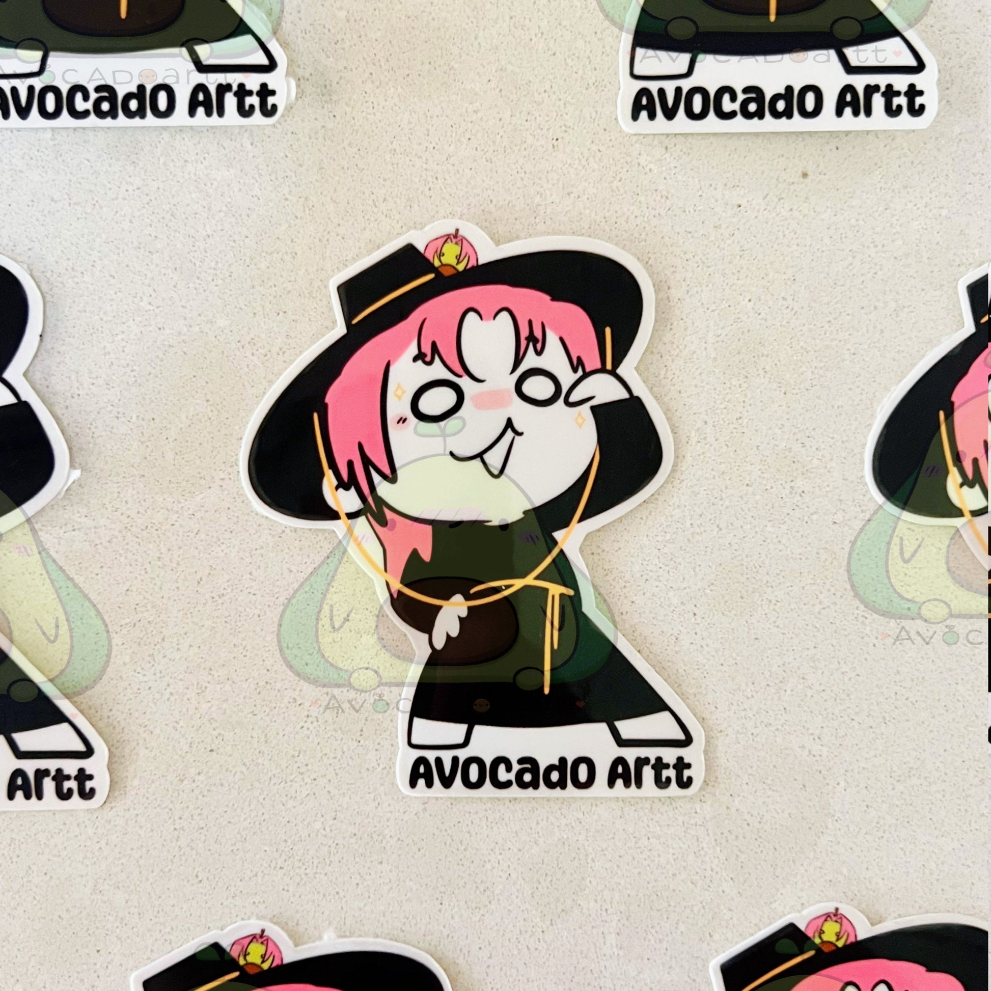 Stickers with a character design labeled 'Avocado Artt' on a beige background