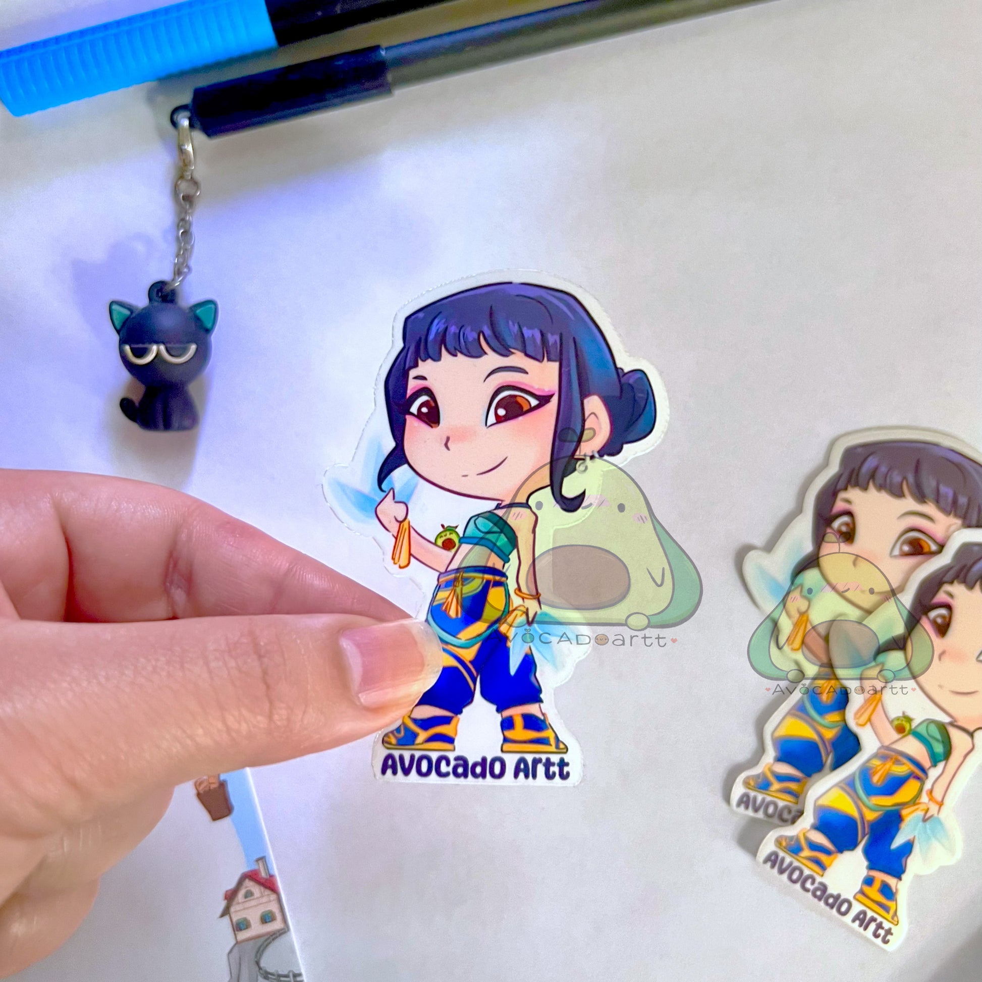 Handmade vinyl sticker of Zoey from K-Pop Demon Hunters, illustrated by Avocado Artt, featuring Zoey in a confident idol pose with detailed outfit and attitude
